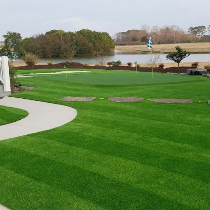 Landscape made with putting green artificial grass by the lake in Carolina