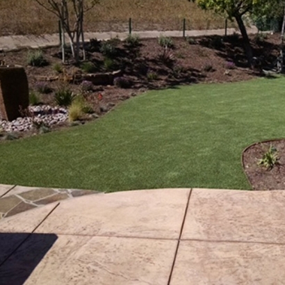 Synthetic turf green backyard stones square pavers landscaping ideas landscape lawn flowers fake artificial grass