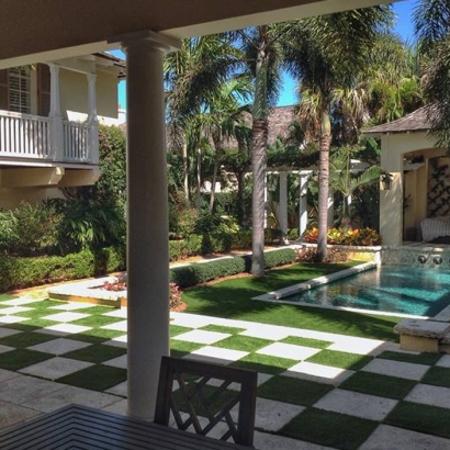 Patio deck design ideas. Swimming pool palm trees artificial grass chess checkered concrete backyard, covered porch.