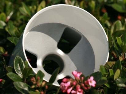 Aluminum white golf cup putting greens in a green grassy background